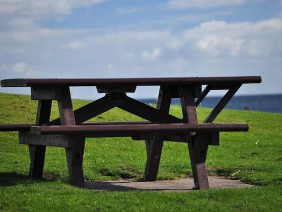 STOCK PICTURE: a wooden picnic bench.