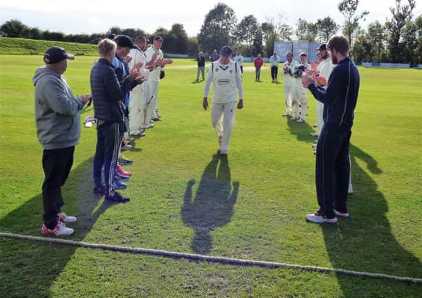 Veteran Brian Gladwin leaves the field to a guard of honour after playing his last match for Chesterfields first team. (PHOTO BY: John Windle)