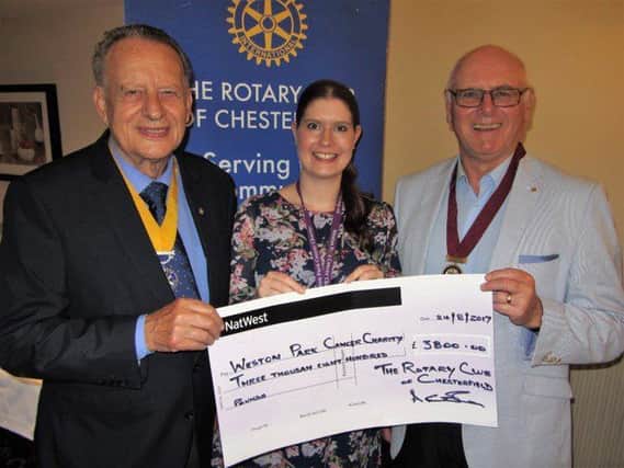 Weston Park Cancer Charity community fundraiser Gemma Noon (centre) receiving a cheque from Chesterfield Rotary president-elect Barry Thompson, (left) and club treasurere and  past-president Alan Clarke (right)