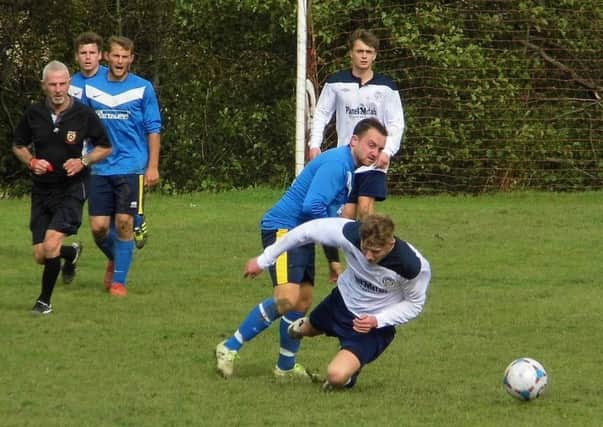 Action from the Second Division clash between New Inn Tupton and Dronfield Vic. (PHOTO BY: Mar Robe)