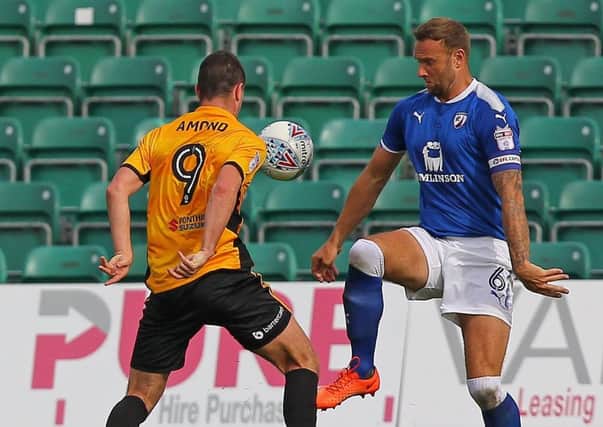 Picture by Gareth Williams/AHPIX.com; Football; Sky Bet League Two; Newport County v Chesterfield; 26/08/2017 KO 15.00; Rodney Parade; copyright picture; Howard Roe/AHPIX.com; Spireites Ian Evatt loses out to Newport's Padraig Amond before Amond slots home a fourth