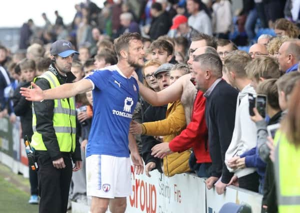 Chesterfield FC v Accrington, Scott Wiseman speaks with angry fans at the full time whistle