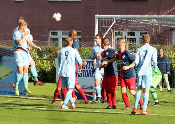 A towering header from George Slack gives Clay Cross Town the lead against Phoenix. (PHOTO BY: David Clark)