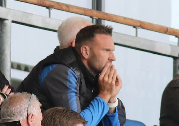 Chesterfield FC v Accrington, Ian Evatt watches from the stand