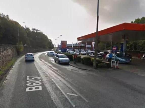 The scene of the crash. You can see the exit on the right as well as the hedge, a parked car and a street light. Picture: Google.