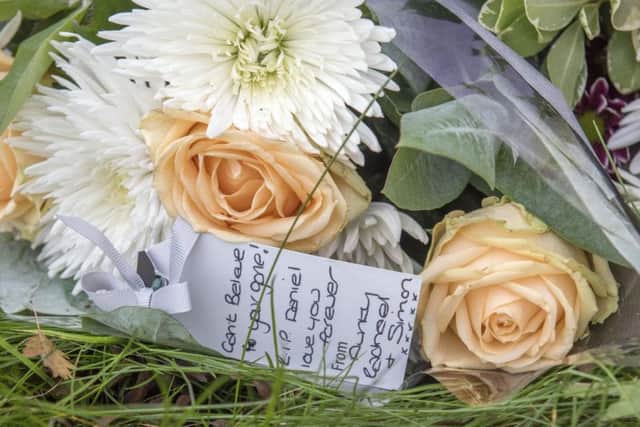 Flowers left at the scene of a fatal road accident on Whittington Road, New Whittington
