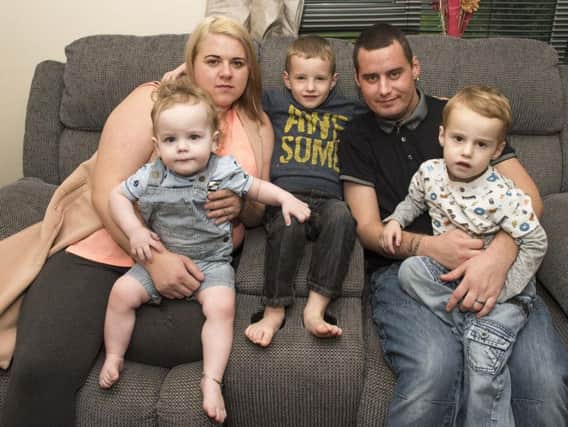 Aaron with his wife Jemma and children Kain, one, Logan, four, and Tyrone, two. Picture: Sarah Washbourn.