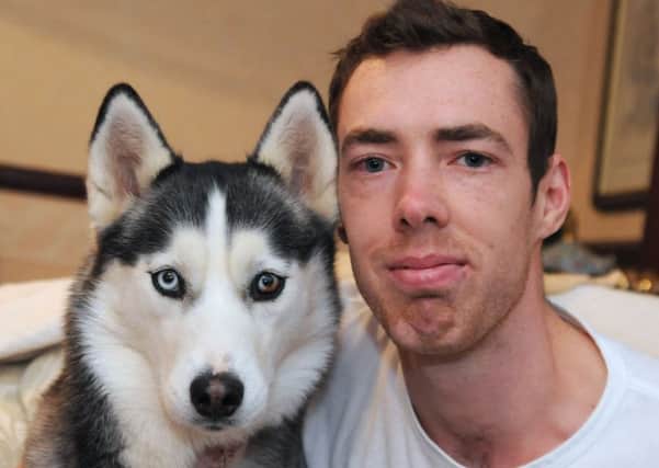 Chris Lomas with his Siberian Husky Misty which was the victim of a dog on dog attack.