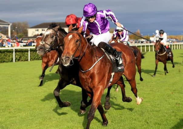 Saxon Warrior wins the Racing Post Trophy at Doncaster to give trainer Aidan O'Brien the new world record for Group One wins in a calendar year.