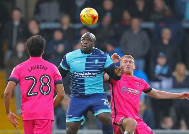 Picture by Gareth Williams/AHPIX.com. Football, Sky Bet League Two; 
Wycombe Wanderers v Hartlepool United; 26/11/2016 KO 3.00pm;  
Adams Park;
copyright picture;Howard Roe/AHPIX.com
Wycombe's Adebayo Akinfenwa flicks on ahead of Pools' Scott Harrison