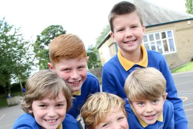 Pupils at Pilsley C of E Primary School are all smiles.