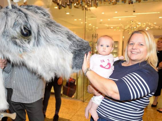 Oh baby, look at this for a first Christmas surprise - families can get up close to meet the reindeer puppets paraded daily at Sheffield's Meadowhall