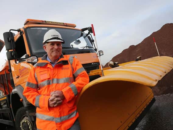Councillor Simon Spencer, Derbyshire County Council Cabinet Member for Highways, Transport and Infrastructure checks the grit stocks at Chesterfield's Stonegravels depot.