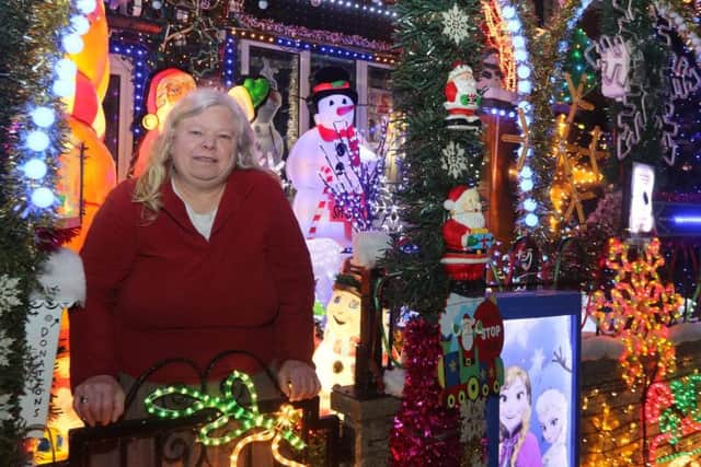 Susan Griffiths outside her impressive festive house on North View Street, Bolsover. Picture by Jason Chadwick.
