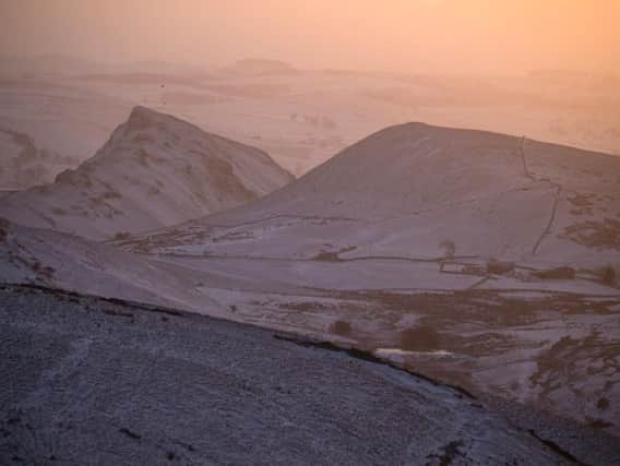 Dawn breaks over Chrome Hill and Parkhouse Hill near Longnor after overnight snowfall in the Derbyshire Peak District. Photo - Rod Kirkpatrick, F Stop Press