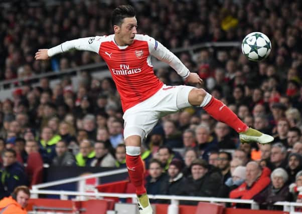 Mesut Ozil, who could yet stay at Arsenal, according to today's rumour mill.