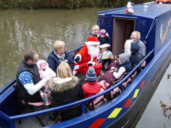 Santa cruises on Chesterfield Canal.