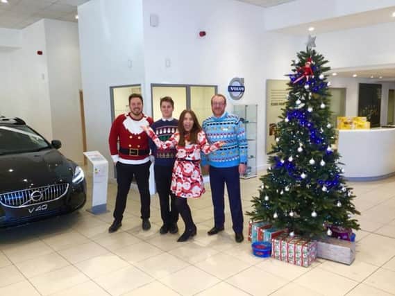 Jono Gould and his colleagues were feeling very festive at work Bristol Street Motors for Christmas Jumper Day