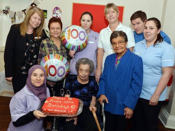 Pictured Phyllis with Lynette, Mavis, Mehta and Karen and other staff at the care home. Picture by Brian Eyre.