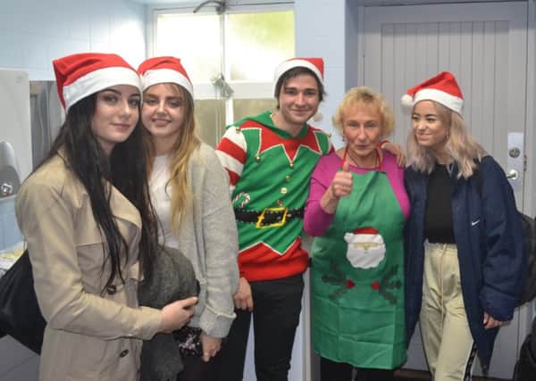 Highfields School students run Christmas lunch in Matlock's Imperial Rooms.