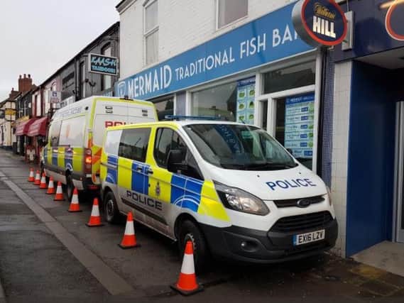 Police outside the Mermaid fish and chip shop on Sheffield Road today.
