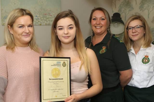 Gaynor Mallard and her daughter Frankie with Jessica Berenzyckyj, 999 call handler and one of the ambulance crew Lynsey Burton