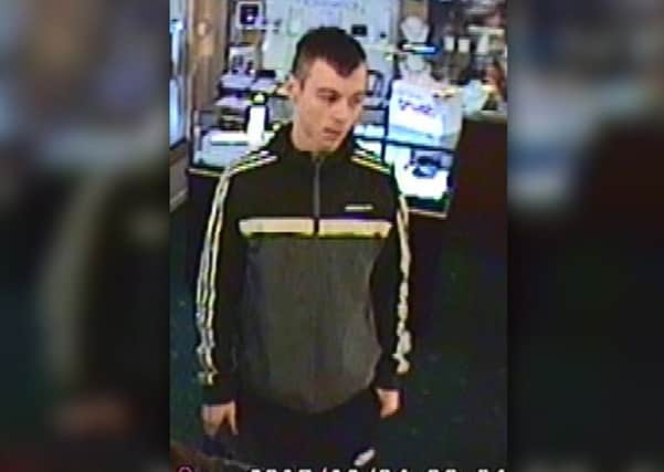 Officers would like to speak to this man in connection with a robbery at a jewellers in Alfreton.
