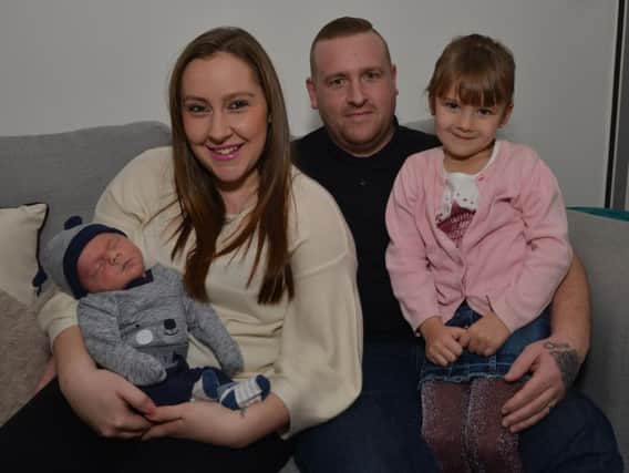 New Year's Day baby Jacob Thompson pictured with mum Natalie Marshall, dad Andrew Thompson and sister Olivia Thompson, five.