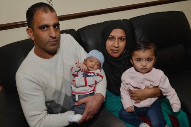 New Year's Day baby Ahad Abbas pictured with his parents Mohammad and Safia and sister Amira.