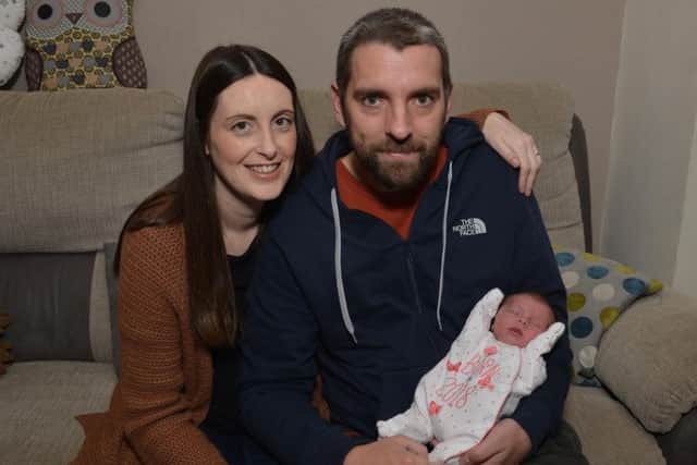 New Year' s Day baby Emily May Vickers pictured with dad Colin Vickers and mum Nicola Harrison.