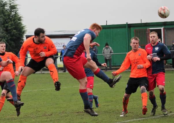 Ryan Ordidge heads for goal during Clay Cross Towns easy 7-2 victory at Phoenix.