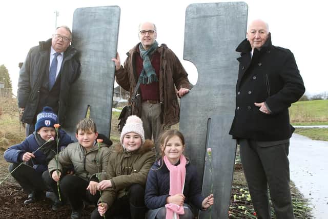 County Councillor Tony King, artist Stephen Broadbent, the Duke of Devonshire and children from Duckmanton Primary School at the unveiling of the seven figures. Pictures by Jason Chadwick.