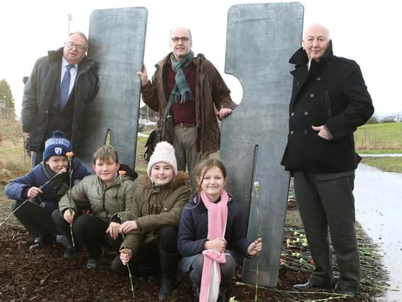County Councillor Tony King, artist Stephen Broadbent, the Duke of Devonshire and children from Duckmanton Primary School at the unveiling of the seven figures. Pictures by Jason Chadwick.