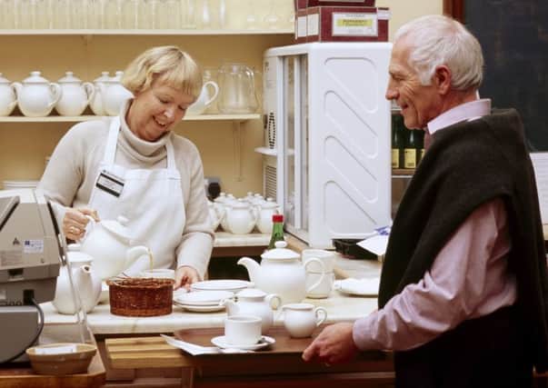 Volunteer serving in the tea room at National Trust property. Photo by Ian Shaw/National Trust Images.