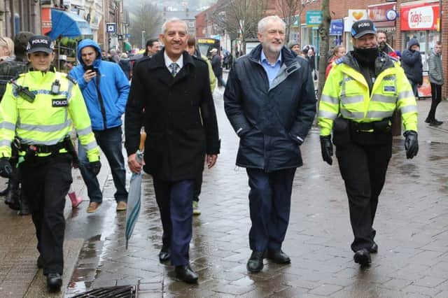 Jeremy Corbyn and Police and Crime Commissioner Hardyal Dhindsa with local officers on their walk through Belper.
