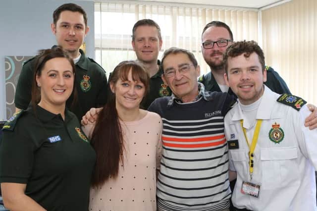 Leonard Lichtveld, with his daughter Tina and the team that worked to save his life - 999 call handler Brodie Bancroft and ambulance crews James Illing, James Farndon, Rebecca Stokes and Ross Wormall.