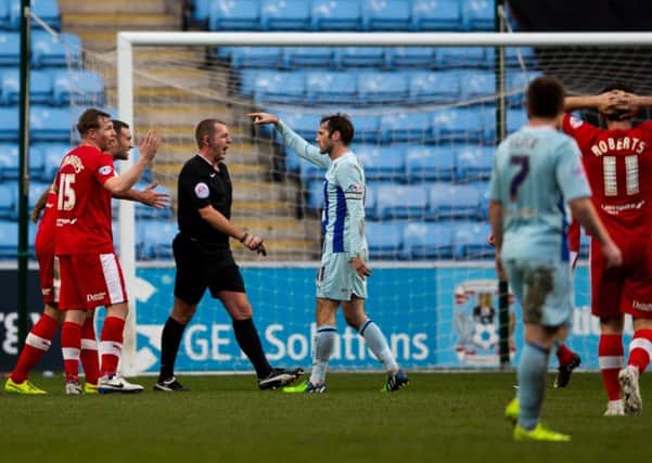 Coventry vs Chesterfield - Chesterfield players protest to referee Darren Handley over a penalty call  - Pic By James Williamson