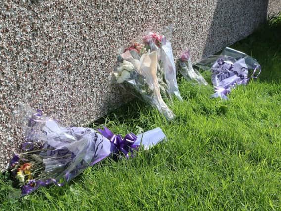 Flowers left outside Thorntree Court following Darren Broadbent's death.