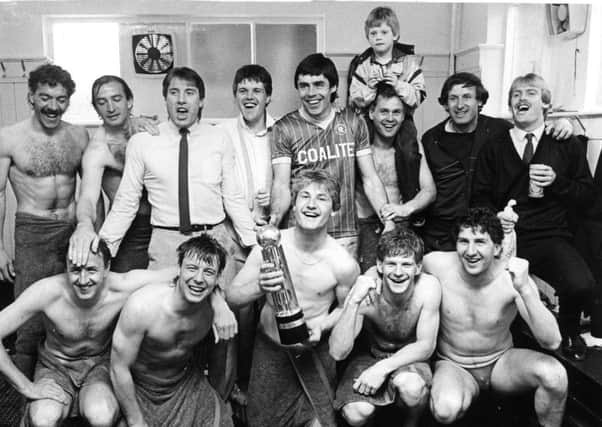 Chris Marples, pictured centre holding the Canon League Division Four championship trophy, in May 1985, after the last game of the season.