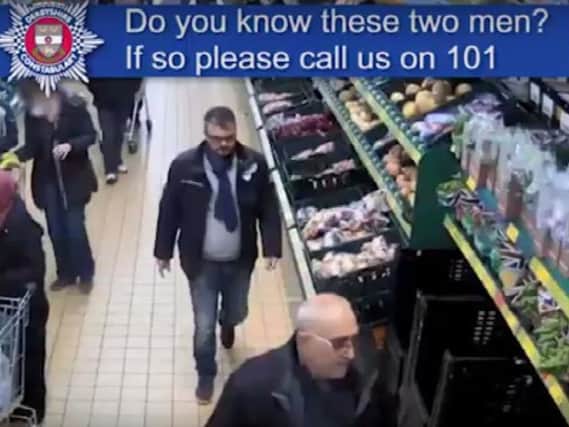 CCTV footage of two men police would like to speak to.