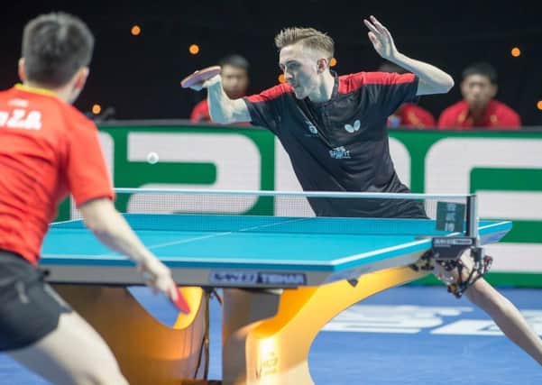 Liam Pitchford in action against world number two Fan Zhendong, of China. (PHOTO BY: Alan Man)