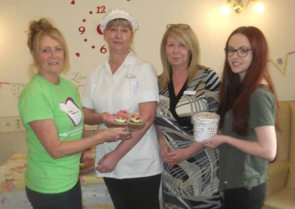 Springbank House Care for a Cuppa event in aid of Ashgate Hospice. Pictured left to right are: Ashgate Hospicecare fundraiser Lyn Community, care home kitchen manager Alison Dunlop, home manager Karen Busby, and care assistant Lucy Gordon.