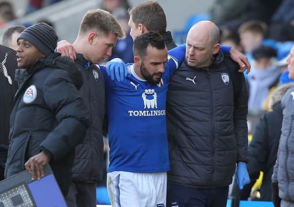 Picture by Gareth Williams/AHPIX.com; Football; Sky Bet League Two; Chesterfield FC v Swindon Town; 24/03/2018 KO 15.00; Proact Stadium; copyright picture; Howard Roe/AHPIX.com; Spireites skipper Robbie Weir is helped off the pitch after picking up an injury