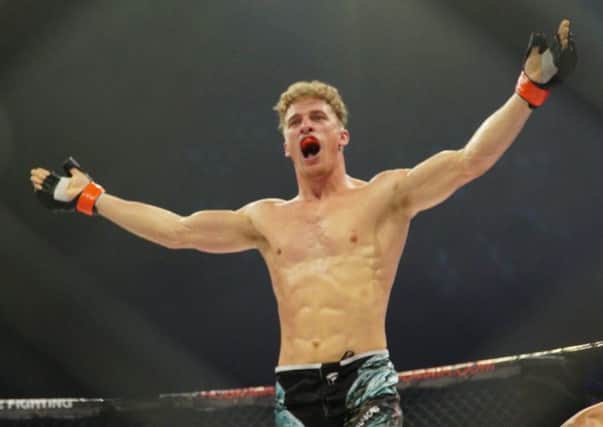 Chesterfield MMA fighter Sam Boult celebrates victory at ACB65 at Sheffield Arena