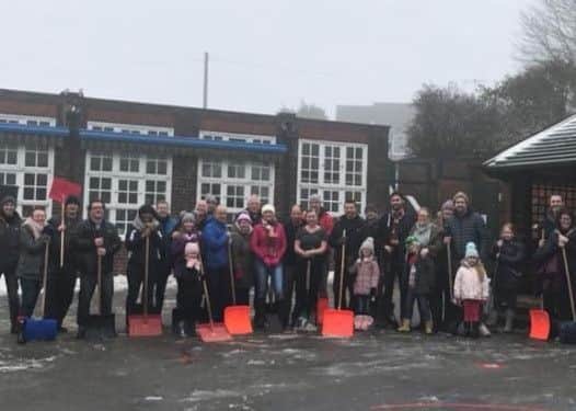Volunteers help clear New Whittington Community Primary School's sites and car park in Chesterfield this weekend.