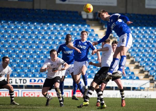 Chesterfield Reserves vs Gateshead Reserves - Laurence Maguire goes for a header - Pic By James Williamson