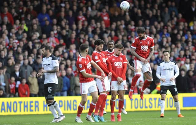 IN PICTURE: Danny Fox clears the free kick.
STORY: SPORT LEAD: Nottingham Forest v Derby County.  Sky Bet Championship match at The City Ground, Nottingham.  Sunday 11th March 2018.