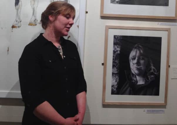 Emma Allsop next to her portrait. Photo contributed by Kate Bellis.