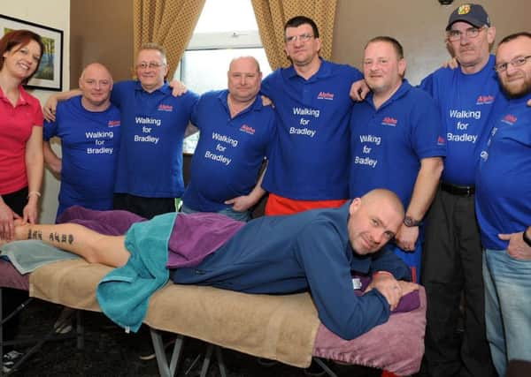 Supporters of  Bradley Lowery, the little boy from Sunderland who touched the heart of the nation, pictured during their stop off at the Arkwright Arms after 198 of their 327 mile sponsored walk, where they were treated to a sports massage by Jane Watts from Optimum Sports Therapy.  They are from left, Graeme Robinson, John Williams, Andy Baxter, Colin Cruddace, Rich Edwards, Billy Mack, Andy King and Mark Busher (on the table).