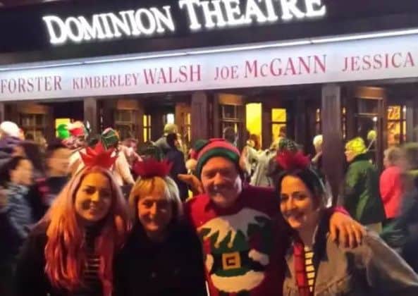 Molly with her family outside the Dominion Theatre in London.